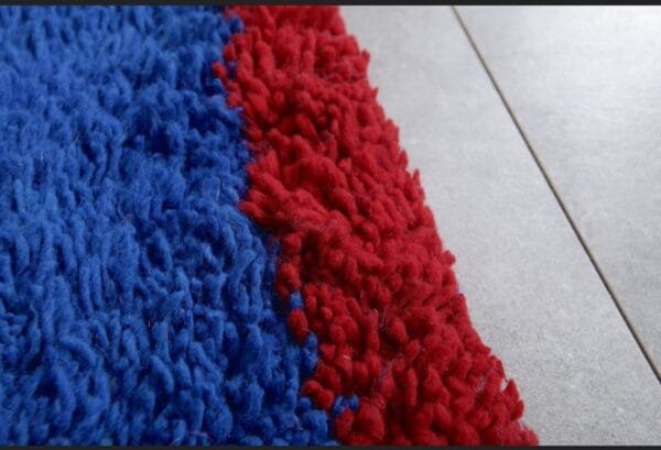 Zouhour – Solid Blue Berber Rug with Red Border