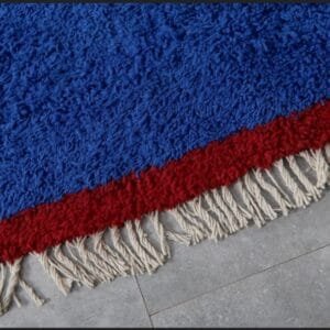 Zouhour – Solid Blue Berber Rug with Red Border