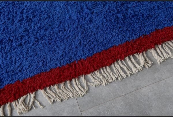 Zouhour – Solid Blue Berber Rug with Red Border
