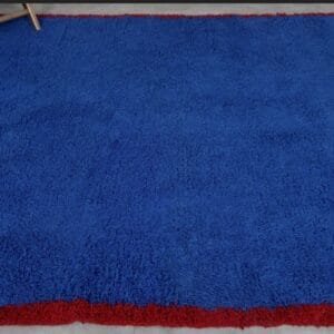 Zouhour – Solid Blue Berber Rug with Red Border