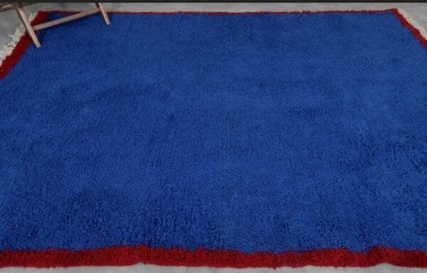 Zouhour – Solid Blue Berber Rug with Red Border