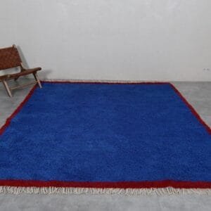Zouhour – Solid Blue Berber Rug with Red Border